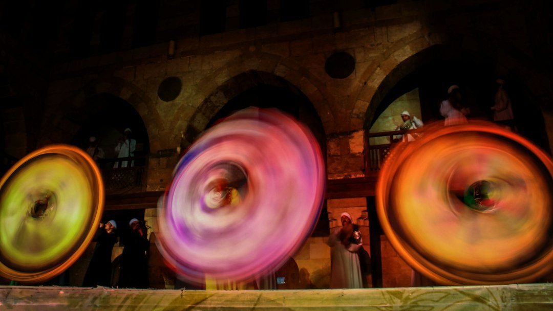 Tanoura dancer spinning in Islamic Cairo